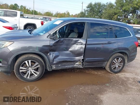 ✅ 2018 Honda Pilot EX-L • VIN: 5FNYF5H59JB027960 • Lot: 43543303. Listed on IAAI with 157,573 mi. Free auction sales archive from the USA and detailed vehicle history report at DreamBid. Image 14.