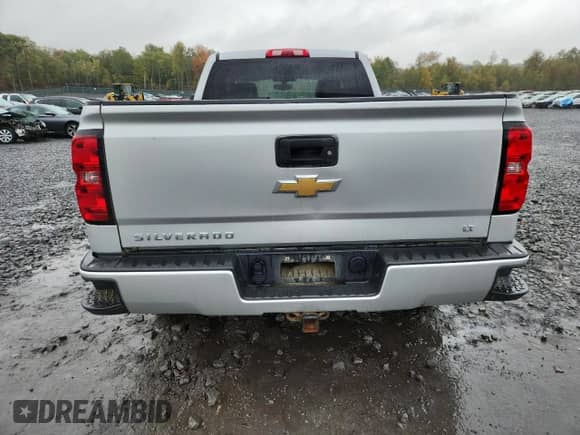 2017 Chevrolet Silverado 1500 LT with VIN 1GCVKREC4HZ326298, listed as a Copart auction lot 85676485 with 104,042 mi miles and Salvage title. Bid and sale history available at DreamBid. Image 6.