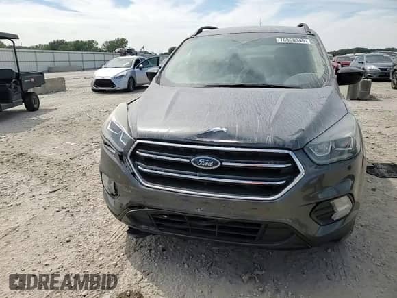 2018 Ford Escape SE z VIN 1FMCU9GD6JUD48647, wystawiony jako Copart lot #70868345 z przebiegiem 102 072 mil mil oraz Szkoda całkowita • Salvage title. Historia ofert i sprzedaży dostępna na DreamBid. Obrazek 14.