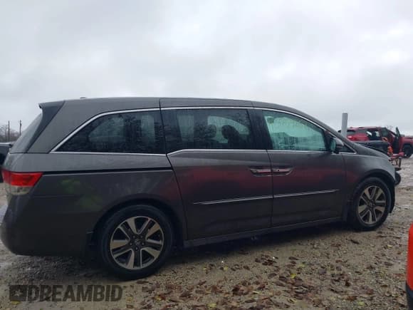 ✅ 2014 Honda Odyssey Touring • VIN: 5FNRL5H94EB128801 • Lot: 43754257. Listed on IAAI with 177,119 mi. Free auction sales archive from the USA and detailed vehicle history report at DreamBid. Image 14.