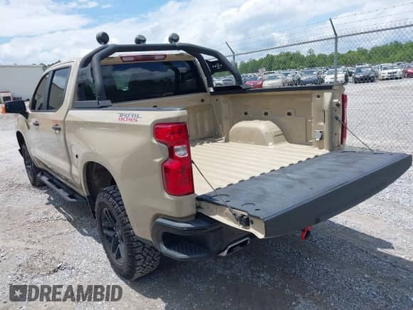 2022 Chevrolet Silverado 1500 Custom Trail Boss with VIN 3GCPDCEDXNG569831, listed as a IAAI auction lot 42241829 with 11,734 mi miles and . Bid and sale history available at DreamBid. Image 3.