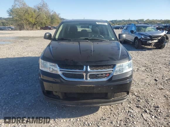 2013 Dodge Journey American Value with VIN 3C4PDCAB5DT597224, listed as a Copart auction lot 82536665 with 104,666 mi miles and Clean title. Bid and sale history available at DreamBid. Image 5.