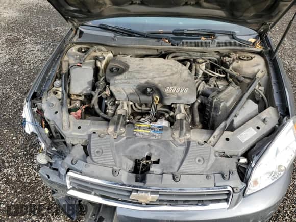 2010 Chevrolet Impala LS z VIN 2G1WA5EN5A1241205, wystawiony jako Copart lot #90408515 z przebiegiem 180 240 mil mil oraz Szkoda całkowita • Salvage title. Historia ofert i sprzedaży dostępna na DreamBid. Obrazek 11.