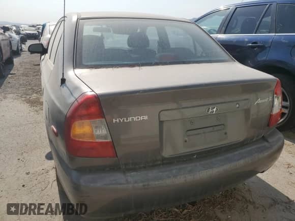 2001 Hyundai Accent GL с VIN KMHCG45C61U259715, выставлен на аукционе Copart как лот 51172295 с пробегом 37 440 миль миль и На запчасти • Non repairable. История ставок и продаж доступна на DreamBid. Изображение 6.