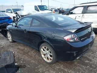 ✅ 2008 Hyundai Tiburon GT • VIN: KMHHN66FX8U268394 • Лот: 43293640. Опубликован ранее на IAAI с пробегом 66 751 миль. Бесплатный доступ к архиву аукционных продаж из США и подробный отчёт об истории автомобиля на DreamBid. Изображение 3.