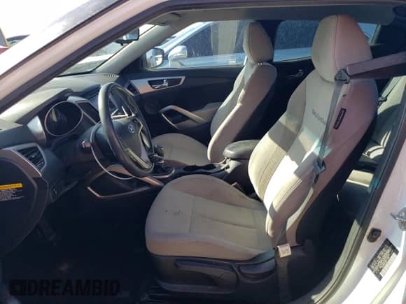 2013 Hyundai Veloster w/Gray Int z VIN KMHTC6AD7DU166325, wystawiony jako Copart lot #69826874 z przebiegiem 176 572 mil mil oraz Szkoda całkowita • Salvage title. Historia ofert i sprzedaży dostępna na DreamBid. Obrazek 7.