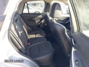 ✅ 2016 Mazda CX-5 Grand Touring • VIN: JM3KE2DY8G0604998 • Lot: 43696169. Listed on IAAI with 104,349 mi. Free auction sales archive from the USA and detailed vehicle history report at DreamBid. Image 8.