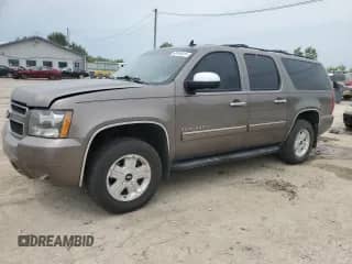 2013 Chevrolet Suburban LT with VIN 1GNSKJE79DR107572, listed as a Copart auction lot 68145015 with 218,004 mi miles and Salvage title. Bid and sale history available at DreamBid. Image 1.