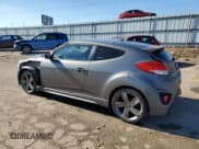 ✅ 2014 Hyundai Veloster Turbo • VIN: KMHTC6AE2EU210063 • Lot: 79243924. Wystawiony na Copart z przebiegiem 130 551 mil. Bezpłatny archiwum sprzedaży aukcyjnych z USA i szczegółowy raport historii pojazdu na DreamBid. Zdjęcie 2.