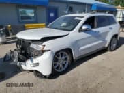 ✅ 2014 Jeep Grand Cherokee Summit • VIN: 1C4RJFJT7EC500405 • Lot: 57310475. Listed on Copart with 136,050 mi. Free auction sales archive from the USA and detailed vehicle history report at DreamBid. Image 1.