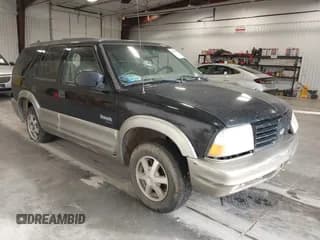 ✅ 1999 Oldsmobile Bravada • VIN: 1GHDT13W7X2717521 • Lot: 43573391. Wystawiony na IAAI z przebiegiem Nie podano. Bezpłatny archiwum sprzedaży aukcyjnych z USA i szczegółowy raport historii pojazdu na DreamBid. Zdjęcie 1.