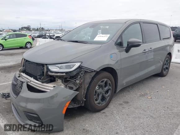 ✅ 2023 Chrysler Pacifica Hybrid Touring L • VIN: 2C4RC1L71PR584485 • Lot: 42056423. Listed on IAAI with 58,955 mi. Free auction sales archive from the USA and detailed vehicle history report at DreamBid. Image 2.
