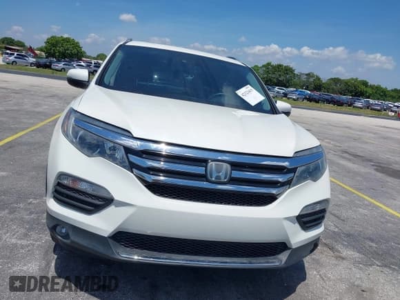 ✅ 2018 Honda Pilot Elite • VIN: 5FNYF6H00JB058623 • Lot: 42323415. Listed on IAAI with 102,015 mi. Free auction sales archive from the USA and detailed vehicle history report at DreamBid. Image 13.