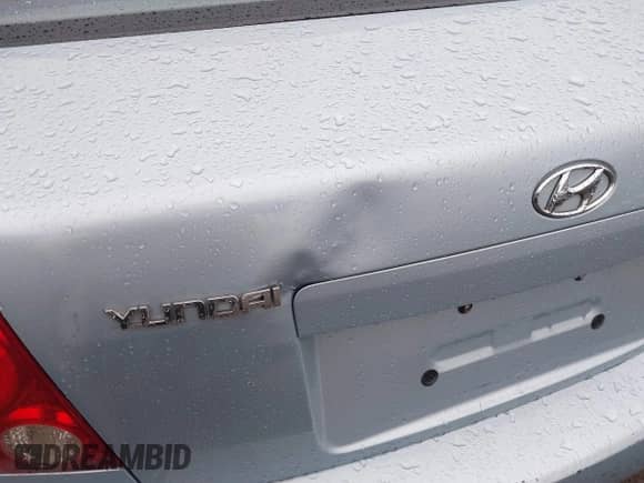 2003 Hyundai Accent GL z VIN KMHCG45C33U473080, wystawiony jako IAAI lot #41868765 z przebiegiem 57 478 mil mil oraz . Historia ofert i sprzedaży dostępna na DreamBid. Obrazek 6.