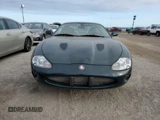 ✅ 2000 Jaguar XK • VIN: SAJJA41BXYPA10261 • Лот: 75336884. Опубликован ранее на Copart с пробегом Не указан. Бесплатный доступ к архиву аукционных продаж из США и подробный отчёт об истории автомобиля на DreamBid. Изображение 5.