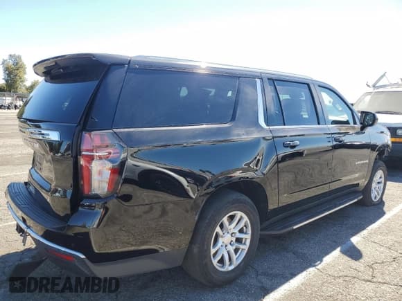 ✅ 2023 Chevrolet Suburban LS • VIN: 1GNSCBKDXPR148942 • Lot: 69675865. Listed on Copart with 81,844 mi. Free auction sales archive from the USA and detailed vehicle history report at DreamBid. Image 3.