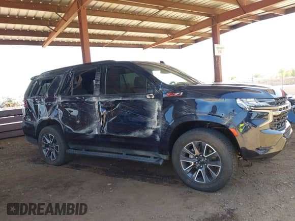 2022 Chevrolet Tahoe Z71 z VIN 1GNSKPKD3NR328938, wystawiony jako IAAI lot #42724313 z przebiegiem 46 394 mil mil oraz . Historia ofert i sprzedaży dostępna na DreamBid. Obrazek 6.