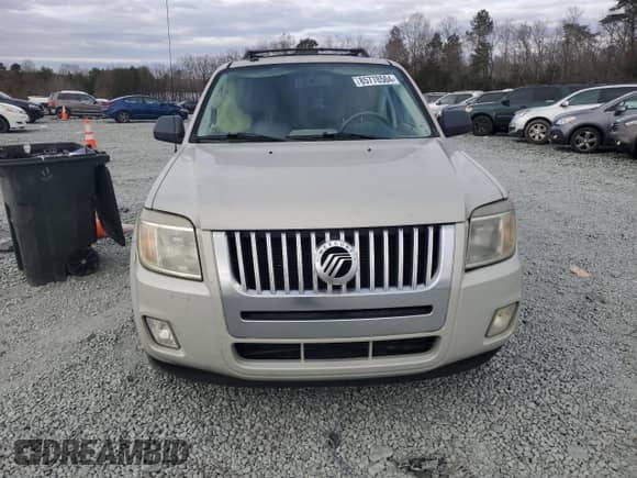 2009 Mercury Mariner with VIN 4M2CU81759KJ04555, listed as a Copart auction lot 85778504 with 130,514 mi miles and Salvage title. Bid and sale history available at DreamBid. Image 5.