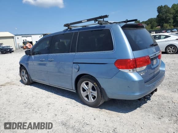 ✅ 2009 Honda Odyssey Touring • VIN: 5FNRL38929B017996 • Лот: 80276195. Опубликован ранее на Copart с пробегом 180 318 миль. Бесплатный доступ к архиву аукционных продаж из США и подробный отчёт об истории автомобиля на DreamBid. Изображение 2.