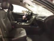 ✅ 2014 Ford Fusion Titanium Hybrid • VIN: 3FA6P0RU1ER217906 • Lot: 42563246. Listed on IAAI with 66,335 mi. Free auction sales archive from the USA and detailed vehicle history report at DreamBid. Image 5.