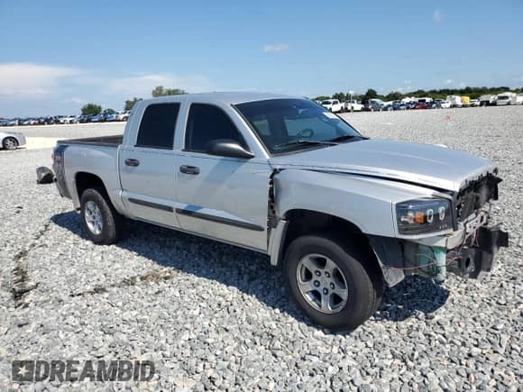 2005 Dodge Dakota ST с VIN 1D7HE28KX5S264544, выставлен на аукционе Copart как лот 69320375 с пробегом 158 784 миль миль и Списание • Salvage title. История ставок и продаж доступна на DreamBid. Изображение 4.