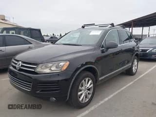 ✅ 2014 Volkswagen Touareg Exec • VIN: WVGEP9BP8ED010092 • Лот: 43552867. Опубликован ранее на IAAI с пробегом 195 008 миль. Бесплатный доступ к архиву аукционных продаж из США и подробный отчёт об истории автомобиля на DreamBid. Изображение 2.