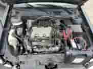 2002 Chevrolet Malibu LS z VIN 1G1NE52J72M586291, wystawiony jako Copart lot #84828864 z przebiegiem 187 205 mil mil oraz Szkoda całkowita • Salvage title. Historia ofert i sprzedaży dostępna na DreamBid. Obrazek 13.