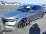 2018 Honda Accord Sport z VIN 1HGCV1F35JA266889, wystawiony jako IAAI lot #43383338 z przebiegiem 64 603 mil mil oraz . Historia ofert i sprzedaży dostępna na DreamBid. Obrazek 19.