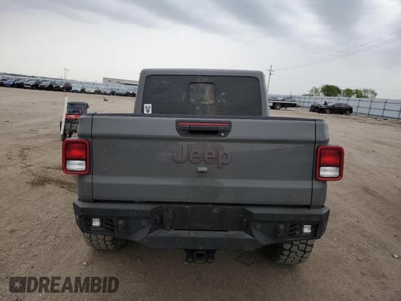 ✅ 2022 Jeep Gladiator Rubicon • VIN: 1C6JJTBG8NL143918 • Лот: 58148705. Опубликован ранее на Copart с пробегом 61 351 миль. Бесплатный доступ к архиву аукционных продаж из США и подробный отчёт об истории автомобиля на DreamBid. Изображение 6.