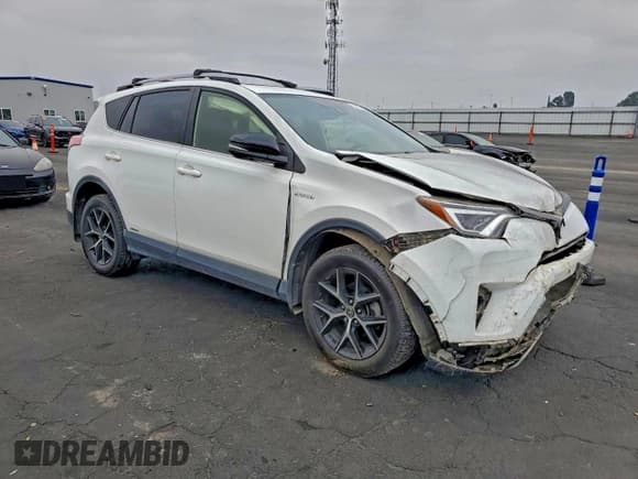 ✅ 2018 Toyota RAV4 Hybrid SE • VIN: JTMJJREV3JD245105 • Lot: 94752565. Listed on Copart with 43,597 mi. Free auction sales archive from the USA and detailed vehicle history report at DreamBid. Image 4.