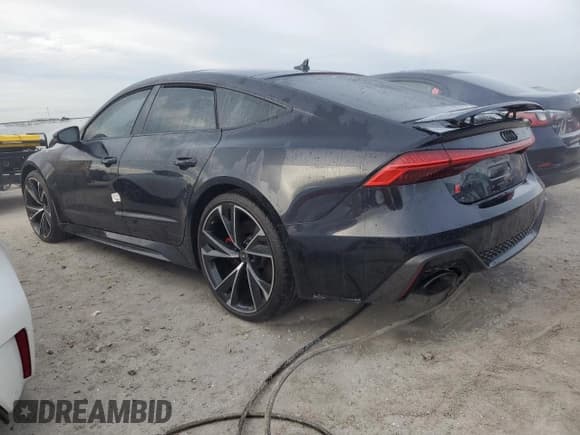 ✅ 2021 Audi RS 7 • VIN: WUAPCBF25MN907221 • Lot: 77997544. Wystawiony na Copart z przebiegiem 28 097 mil. Bezpłatny archiwum sprzedaży aukcyjnych z USA i szczegółowy raport historii pojazdu na DreamBid. Zdjęcie 2.