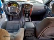 ✅ 2003 Kia Sorento LX • VIN: KNDJD733835050899 • Лот: 94786855. Опубликован ранее на Copart с пробегом 135 052 миль. Бесплатный доступ к архиву аукционных продаж из США и подробный отчёт об истории автомобиля на DreamBid. Изображение 8.