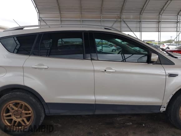✅ 2015 Ford Escape Titanium • VIN: 1FMCU0J91FUA27610 • Lot: 42095995. Listed on IAAI with 122,521 mi. Free auction sales archive from the USA and detailed vehicle history report at DreamBid. Image 14.