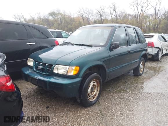 ✅ 2001 Kia Sportage • VIN: KNDJB723115060520 • Лот: 40875026. Опубликован ранее на IAAI с пробегом 133 900 миль. Бесплатный доступ к архиву аукционных продаж из США и подробный отчёт об истории автомобиля на DreamBid. Изображение 2.