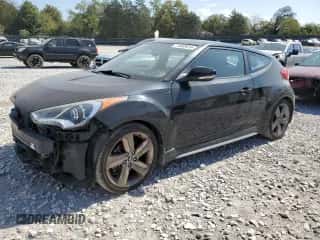 2015 Hyundai Veloster Turbo z VIN KMHTC6AE6FU232889, wystawiony jako Copart lot #71652674 z przebiegiem 122 709 mil mil oraz Szkoda całkowita • Salvage title. Historia ofert i sprzedaży dostępna na DreamBid. Obrazek 1.