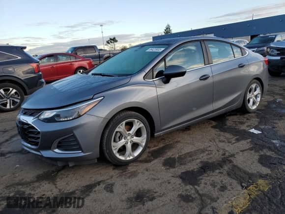 2019 Chevrolet Cruze Premier z VIN 1G1BF5SM5K7100490, wystawiony jako Copart lot #86423935 z przebiegiem 43 494 mil mil oraz Czysty tytuł • Clean title. Historia ofert i sprzedaży dostępna na DreamBid. Obrazek 1.