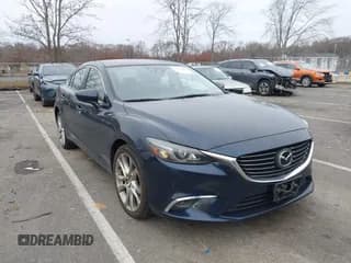 ✅ 2016 Mazda 6 i Grand Touring • VIN: JM1GJ1W51G1401291 • Lot: 43859694. Listed on IAAI with 85,322 mi. Free auction sales archive from the USA and detailed vehicle history report at DreamBid. Image 1.