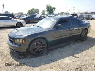 2006 Dodge Charger SRT-8 с VIN 2B3LA73WX6H474014, выставлен на аукционе Copart как лот 60564085 с пробегом Не указан миль и Списание • Salvage title. История ставок и продаж доступна на DreamBid. Изображение 1.