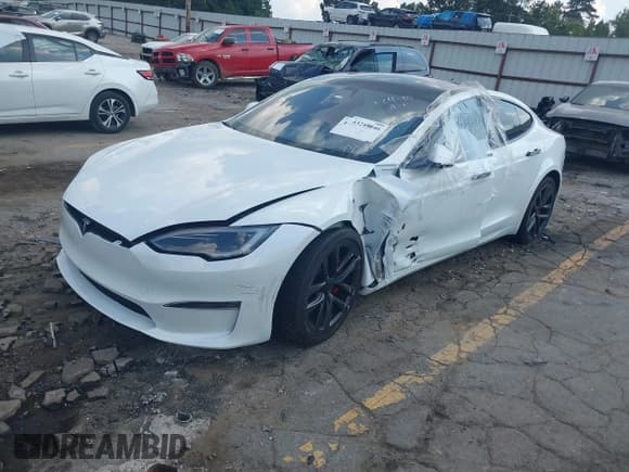 ✅ 2023 Tesla Model S Plaid • VIN: 5YJSA1E63PF521945 • Lot: 43248046. Listed on IAAI with 26,327 mi. Free auction sales archive from the USA and detailed vehicle history report at DreamBid. Image 2.