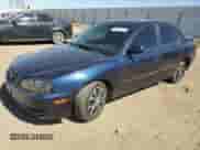 2004 Hyundai Elantra GLS z VIN KMHDN46D44U795391, wystawiony jako Copart lot #75137154 z przebiegiem 154 011 mil mil oraz Szkoda całkowita • Salvage title. Historia ofert i sprzedaży dostępna na DreamBid. Obrazek 1.