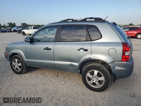 2006 Hyundai Tucson GL with VIN KM8JM12B86U411849, listed as a Copart auction lot 69301264 with 125,056 mi miles and Salvage title. Bid and sale history available at DreamBid. Image 2.