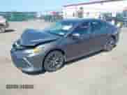 2022 Toyota Camry Hybrid XLE with VIN 4T1F31AK2NU597994, listed as a IAAI auction lot 42550485 with 71,900 mi miles and . Bid and sale history available at DreamBid. Image 2.