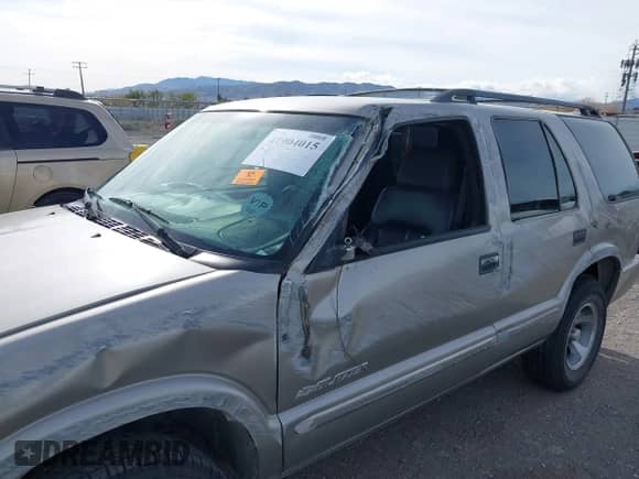 2004 Chevrolet Blazer Fleet z VIN 1GNCS13X54K143744, wystawiony jako IAAI lot #41904015 z przebiegiem Nie podano mil oraz . Historia ofert i sprzedaży dostępna na DreamBid. Obrazek 6.