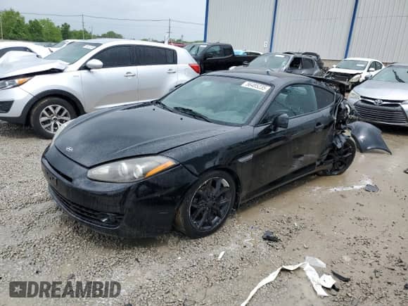 2008 Hyundai Tiburon GT с VIN KMHHN66F08U289898, выставлен на аукционе Copart как лот 56485235 с пробегом 169 568 миль миль и На запчасти • Non repairable. История ставок и продаж доступна на DreamBid. Изображение 1.