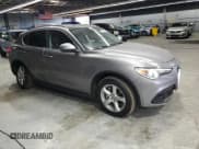 ✅ 2018 Alfa Romeo Stelvio • VIN: ZASFAKAN7J7C01195 • Lot: 82287485. Listed on Copart with 62,431 mi. Free auction sales archive from the USA and detailed vehicle history report at DreamBid. Image 4.