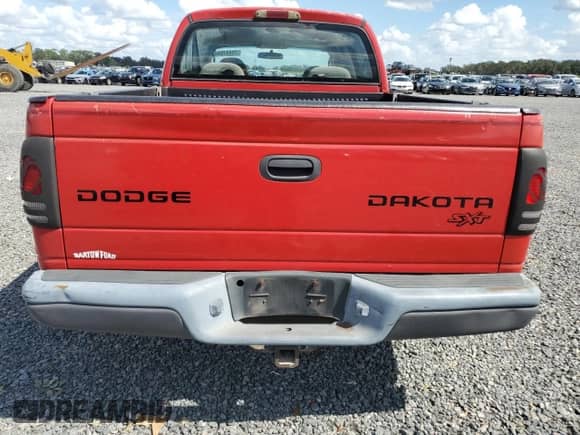 2003 Dodge Dakota Sport z VIN 1D7HL38X23S227220, wystawiony jako Copart lot #75947844 z przebiegiem Nie podano mil oraz Szkoda całkowita • Salvage title. Historia ofert i sprzedaży dostępna na DreamBid. Obrazek 6.