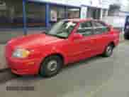 2004 Hyundai Accent GL z VIN KMHCG45C94U538368, wystawiony jako Copart lot #42444565 z przebiegiem 163 028 mil mil oraz Szkoda całkowita • Salvage title. Historia ofert i sprzedaży dostępna na DreamBid. Obrazek 1.
