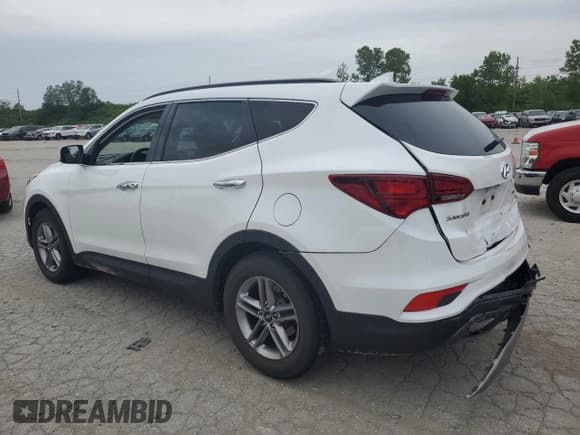 ✅ 2018 Hyundai Santa Fe 2.4L • VIN: 5NMZU3LB7JH056089 • Лот: 53609934. Опубликован ранее на Copart с пробегом 104 843 миль. Бесплатный доступ к архиву аукционных продаж из США и подробный отчёт об истории автомобиля на DreamBid. Изображение 2.