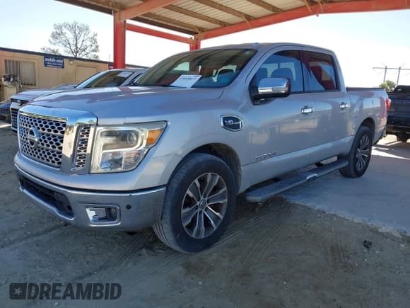 ✅ 2017 Nissan Titan Platinum Reserve • VIN: 1N6AA1E68HN542396 • Lot: 43688877. Listed on IAAI with 124,644 mi. Free auction sales archive from the USA and detailed vehicle history report at DreamBid. Image 2.