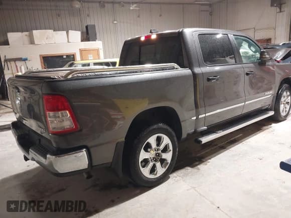 ✅ 2023 Ram 1500 Big Horn • VIN: 1C6RRFFG4PN667047 • Lot: 42300495. Listed on IAAI with 5,061 mi. Free auction sales archive from the USA and detailed vehicle history report at DreamBid. Image 4.